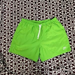 Nike polyester standard fit shorts, mid thigh length. Lime green size XXL.